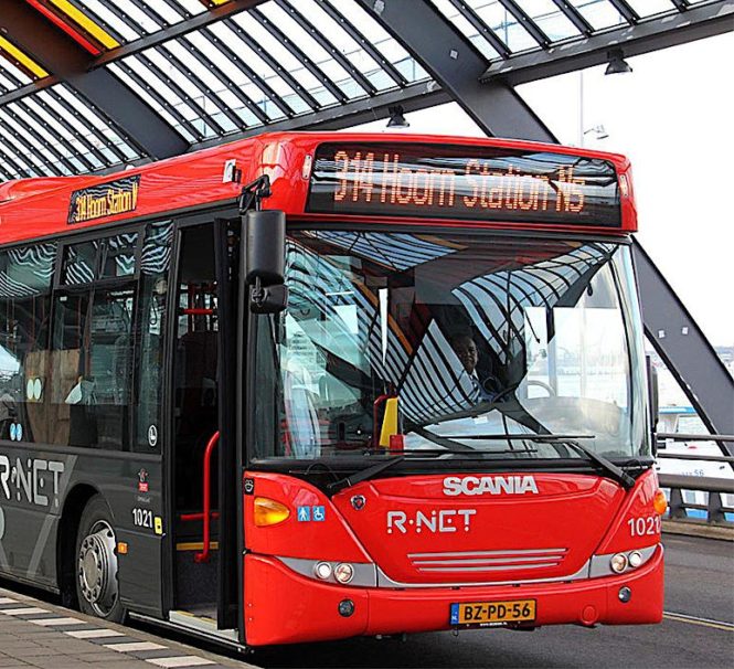 A Scania bus in operation at Amsterdam Central Station, the Netherlands.